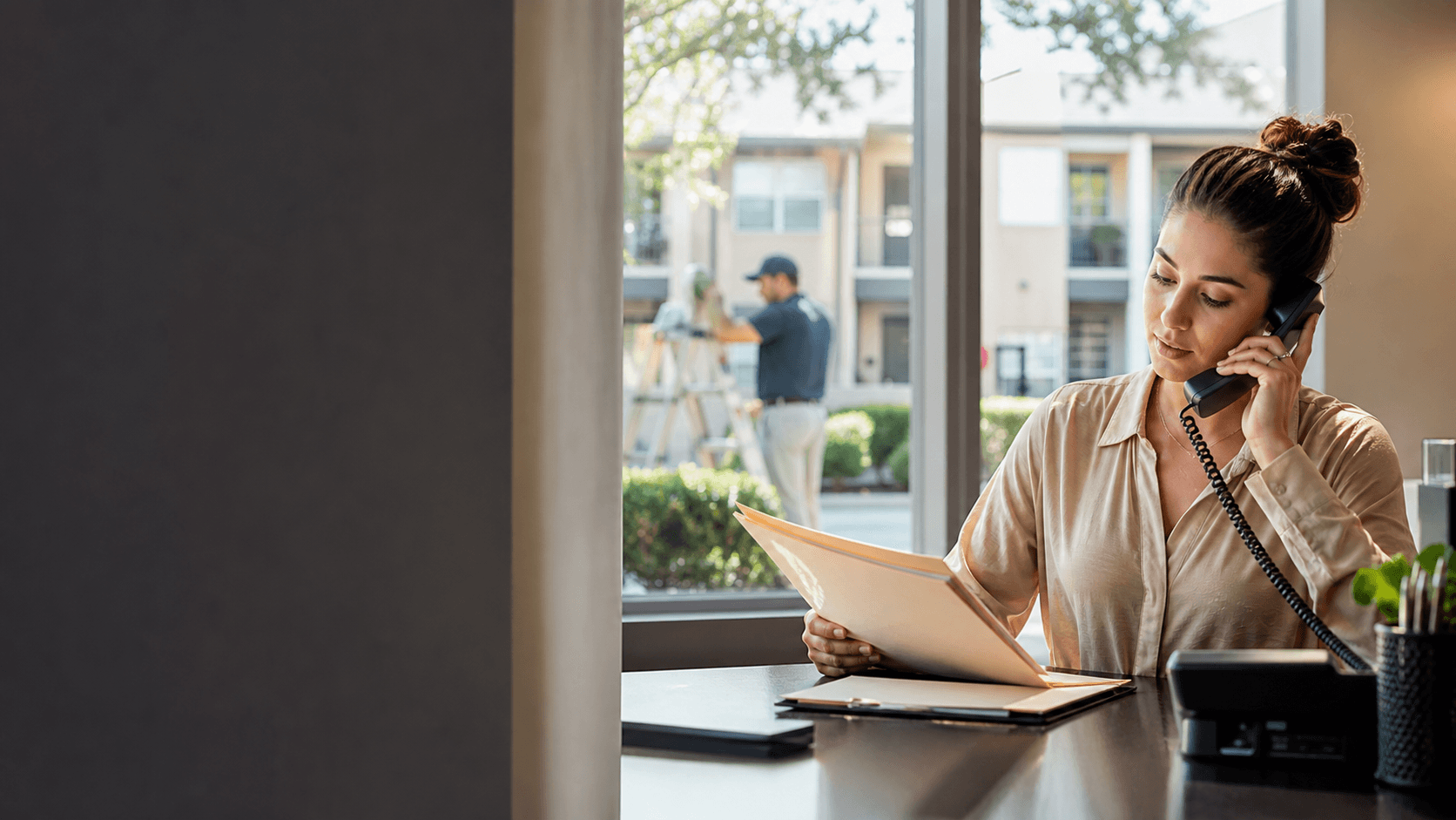 Property management coordinator handling resident calls